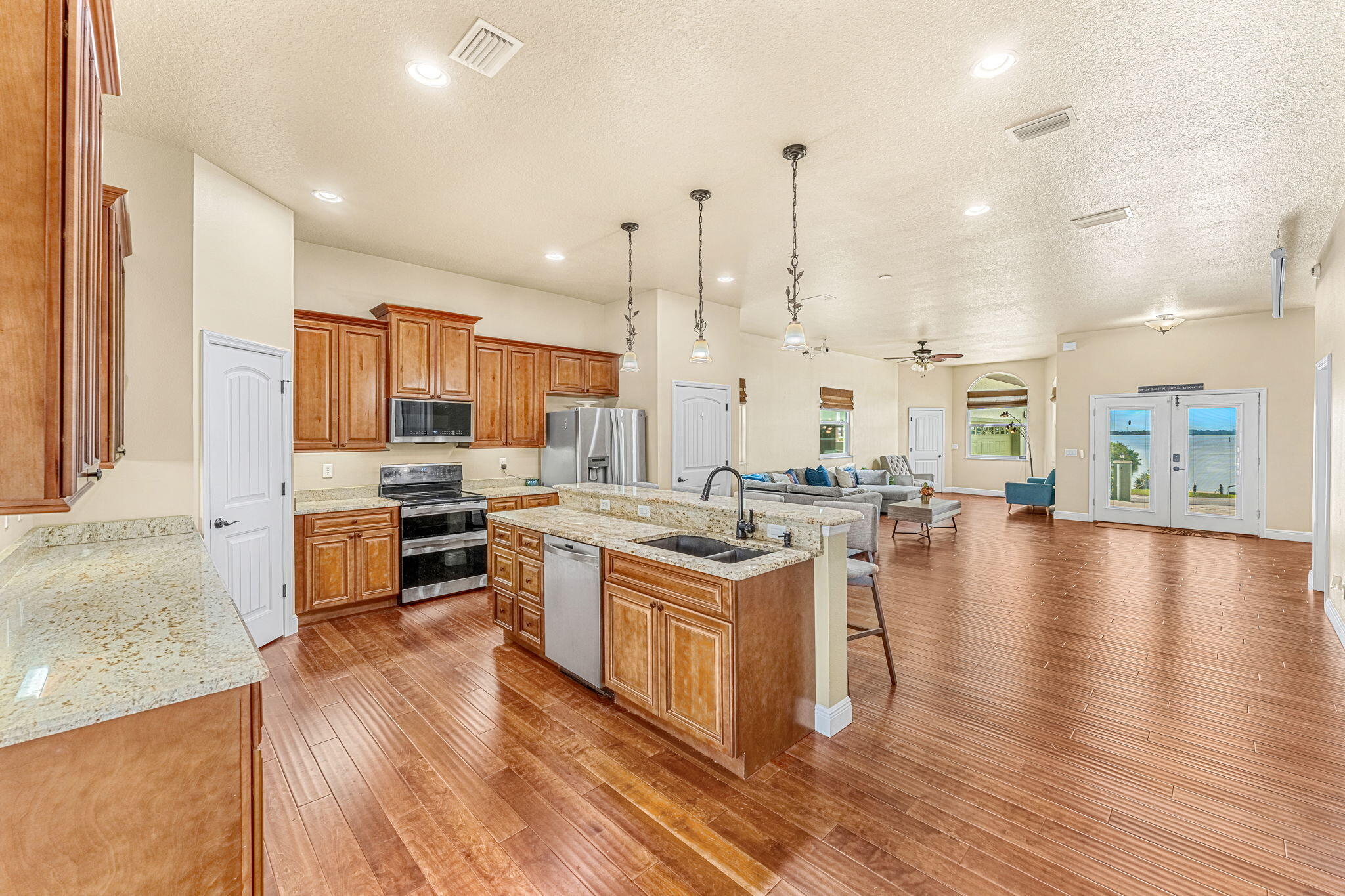 3119 Indian River Drive Cocoa, FL 32922 - Photo 14 of 47 a kitchen with stainless steel appliances and wooden floor