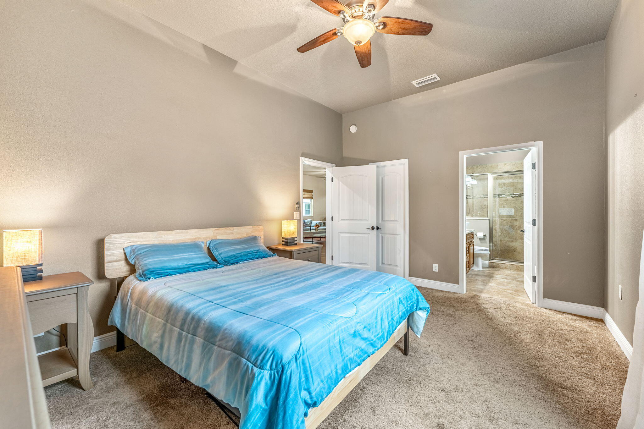 3119 Indian River Drive Cocoa, FL 32922 - Photo 17 of 47 a bedroom with a bed and a chandelier