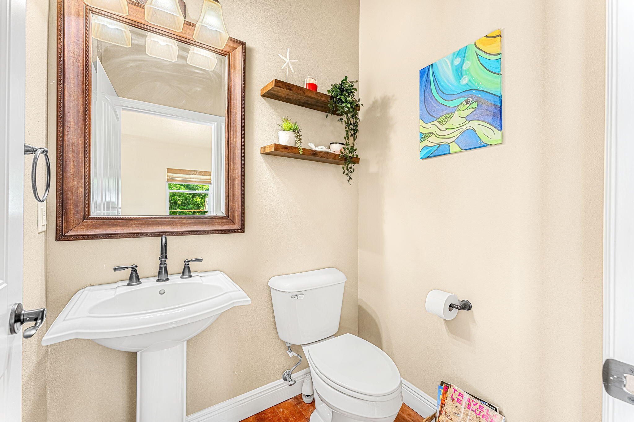 3119 Indian River Drive Cocoa, FL 32922 - Photo 20 of 47 a bathroom with a sink mirror vanity and toilet