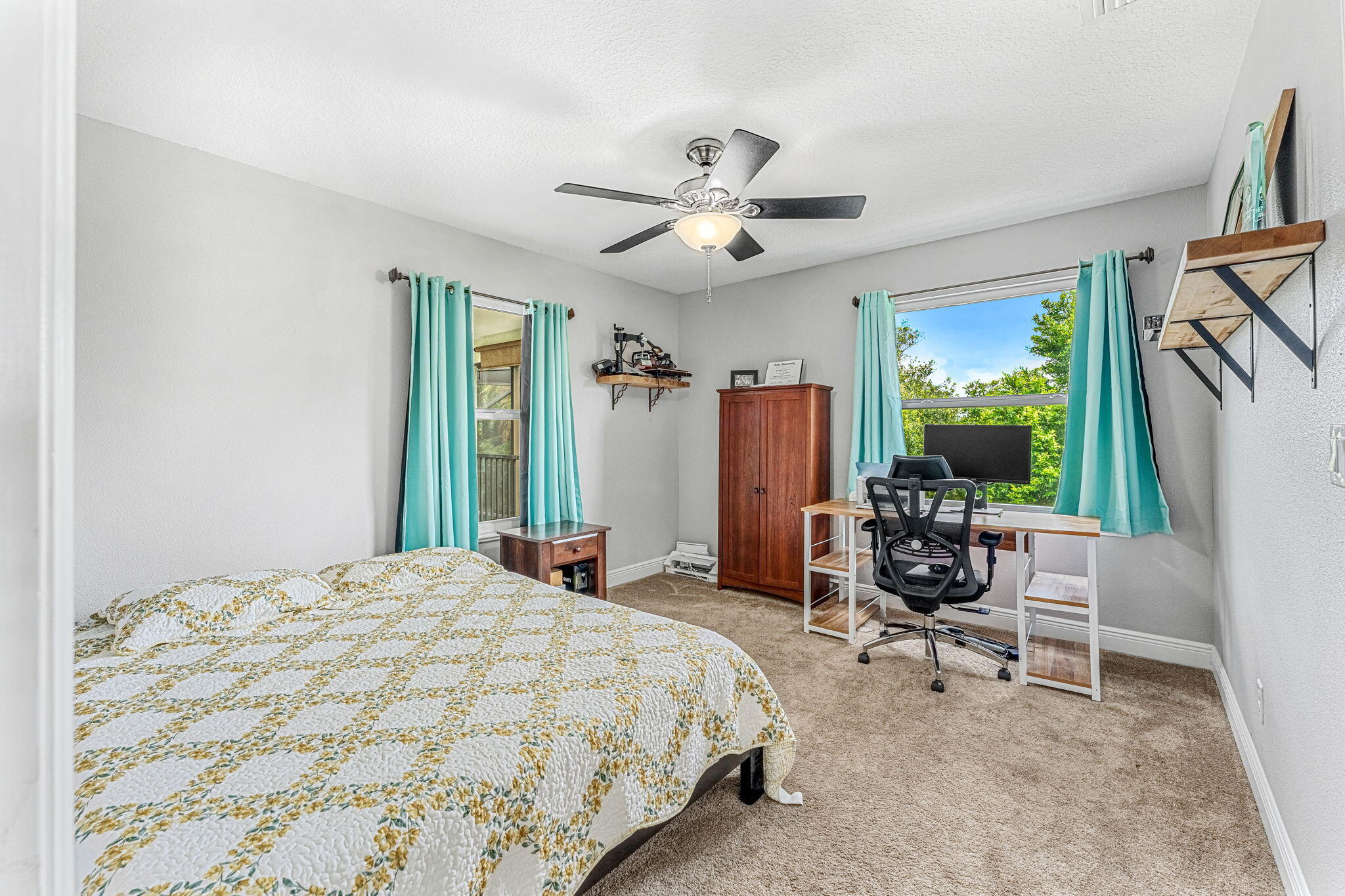 3119 Indian River Drive Cocoa, FL 32922 - Photo 27 of 47 a bed room with a bed and a chair