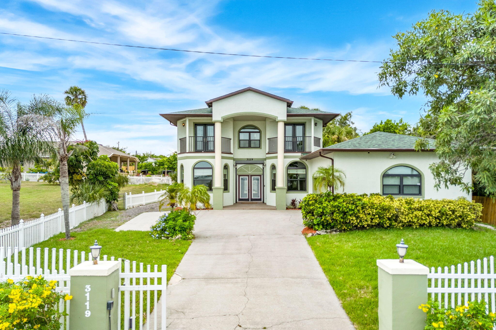 3119 Indian River Drive Cocoa, FL 32922 - Photo 45 of 47 a front view of a house with a garden
