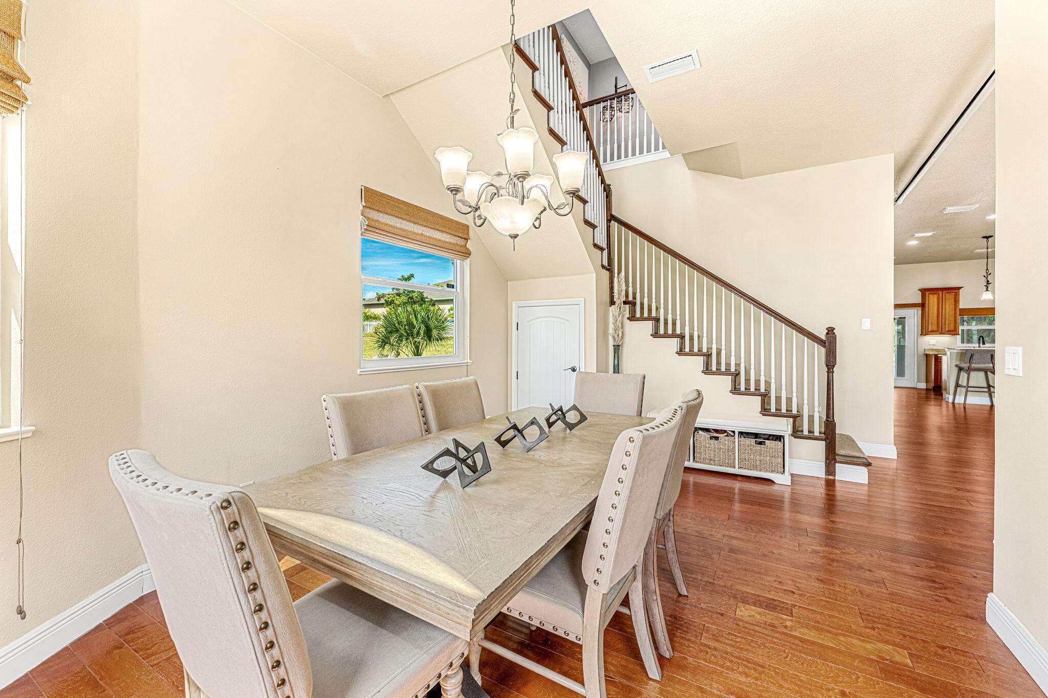 3119 Indian River Drive Cocoa, FL 32922 - Photo 6 of 47 a view of a dining room with furniture wooden floor and chandelier