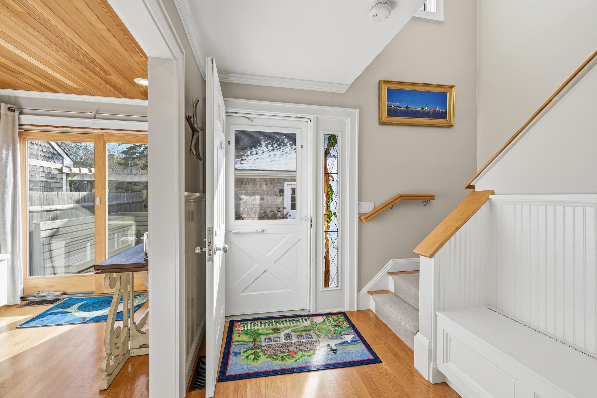 1 Belmont Road, Unit TH22 West Harwich, MA 02671 - Photo 3 of 44 a view of entryway with wooden floor and a rug
