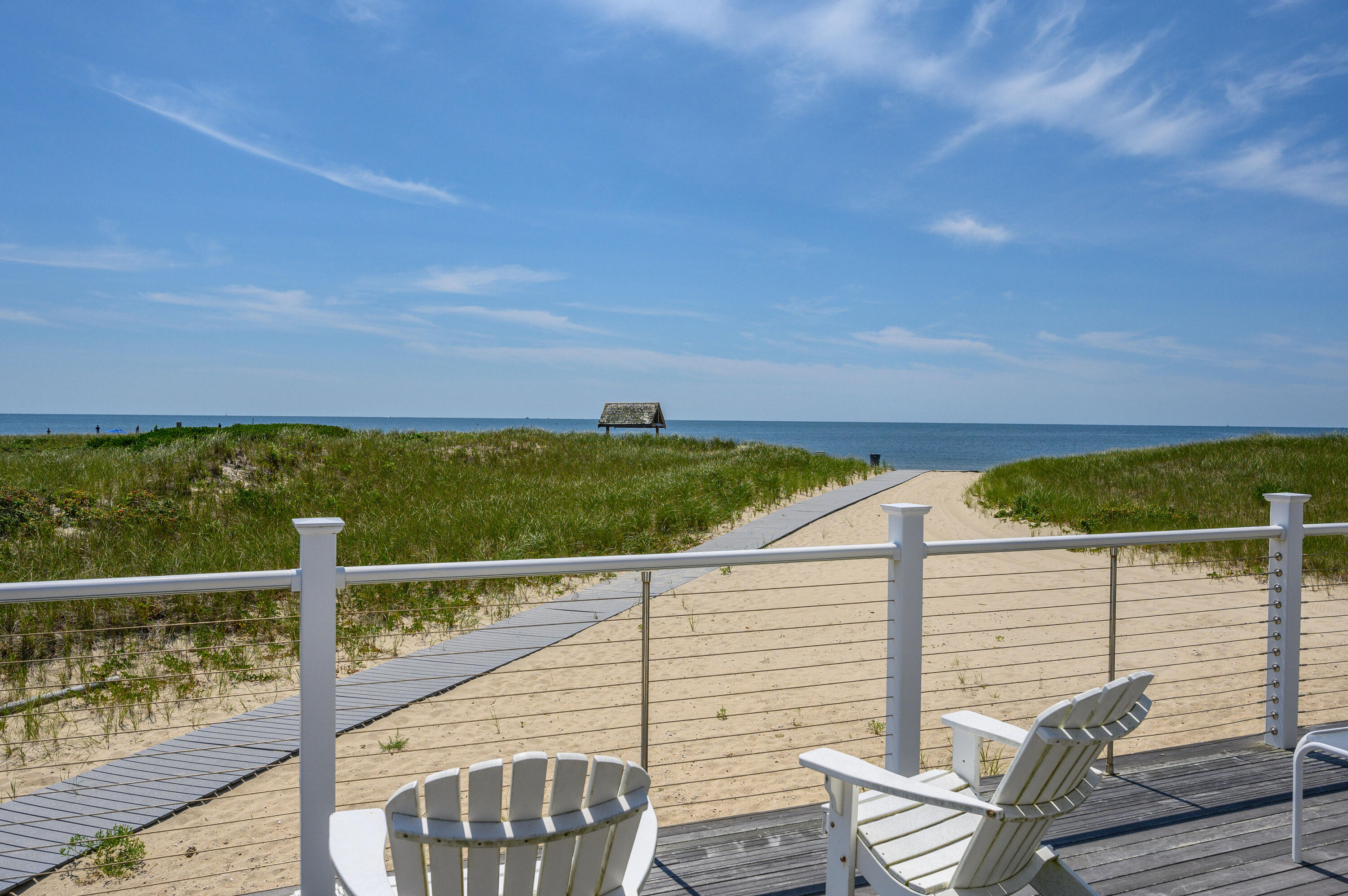 1 Belmont Road, Unit TH22 West Harwich, MA 02671 - Photo 39 of 44 a view of a balcony with floor to ceiling windows with wooden floor