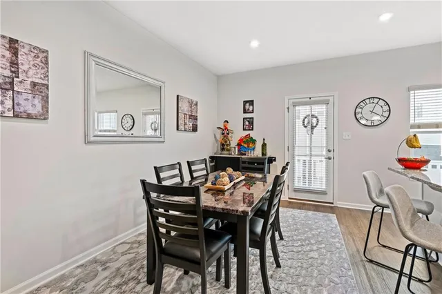 a view of a dining room with furniture and a table