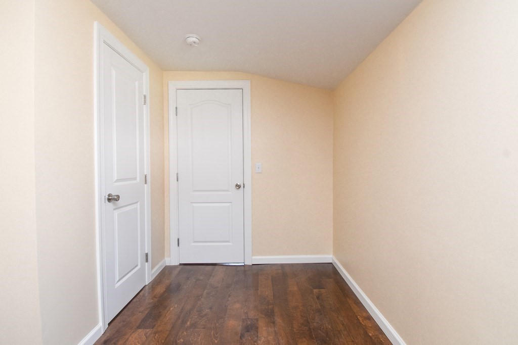 88 Dimmick Street Springfield, MA 01109 - Photo 17 of 36 a view of an empty room with wooden floor