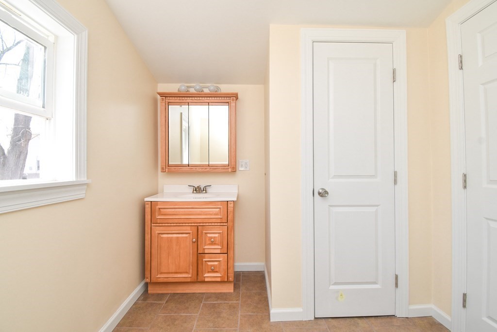 88 Dimmick Street Springfield, MA 01109 - Photo 18 of 36 an empty room with windows and closet