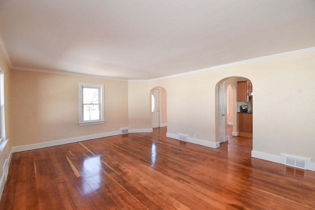 88 Dimmick Street Springfield, MA 01109 - Photo 2 of 36 a view of empty room with wooden floor and window