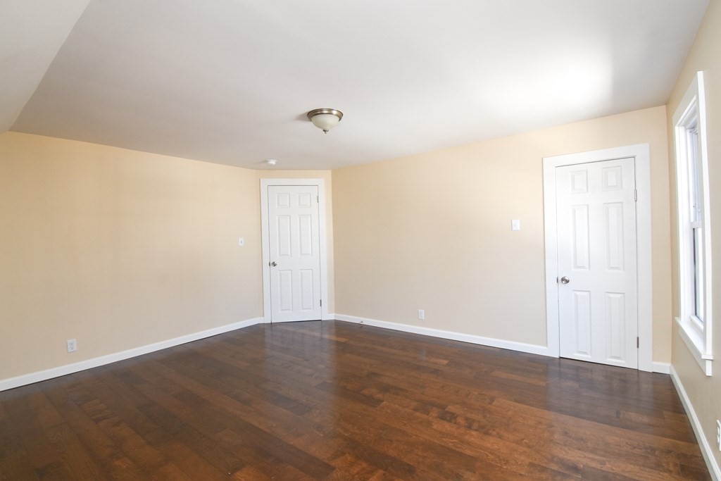 88 Dimmick Street Springfield, MA 01109 - Photo 21 of 36 a view of an empty room with wooden floor