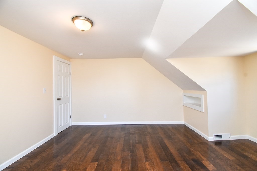 88 Dimmick Street Springfield, MA 01109 - Photo 27 of 36 a view of an empty room with wooden floor