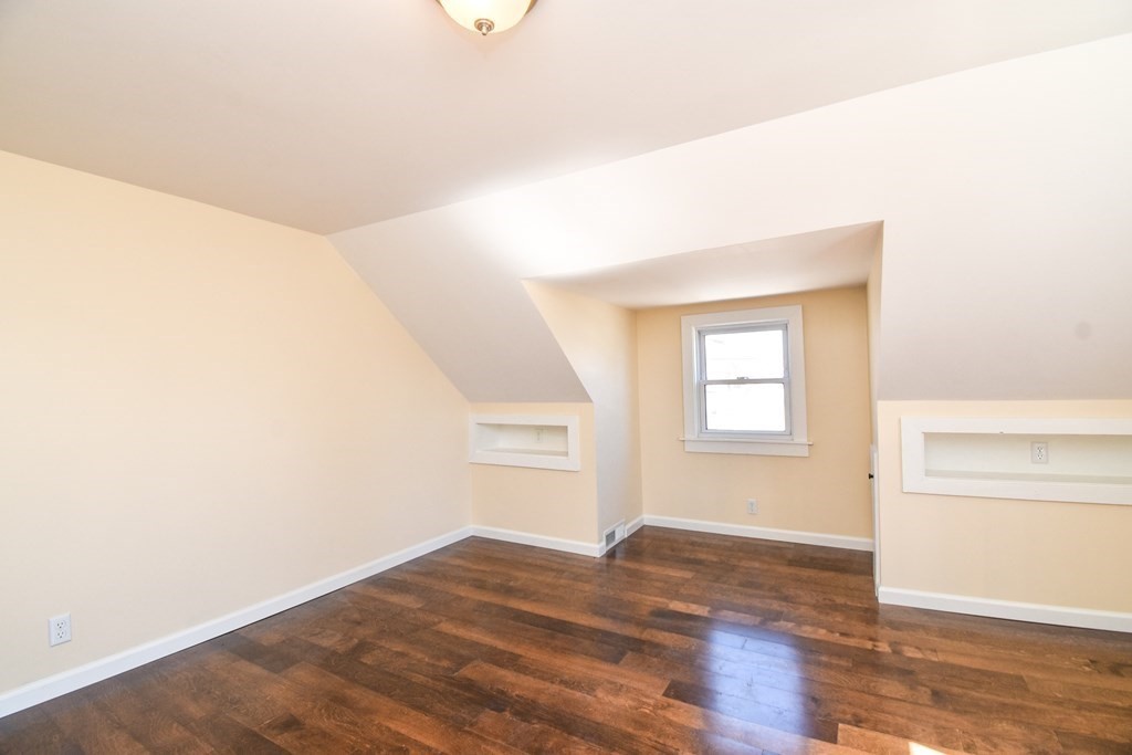 88 Dimmick Street Springfield, MA 01109 - Photo 28 of 36 an empty room with wooden floor and windows