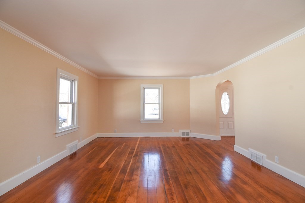 88 Dimmick Street Springfield, MA 01109 - Photo 3 of 36 a view of empty room with wooden floor and fan