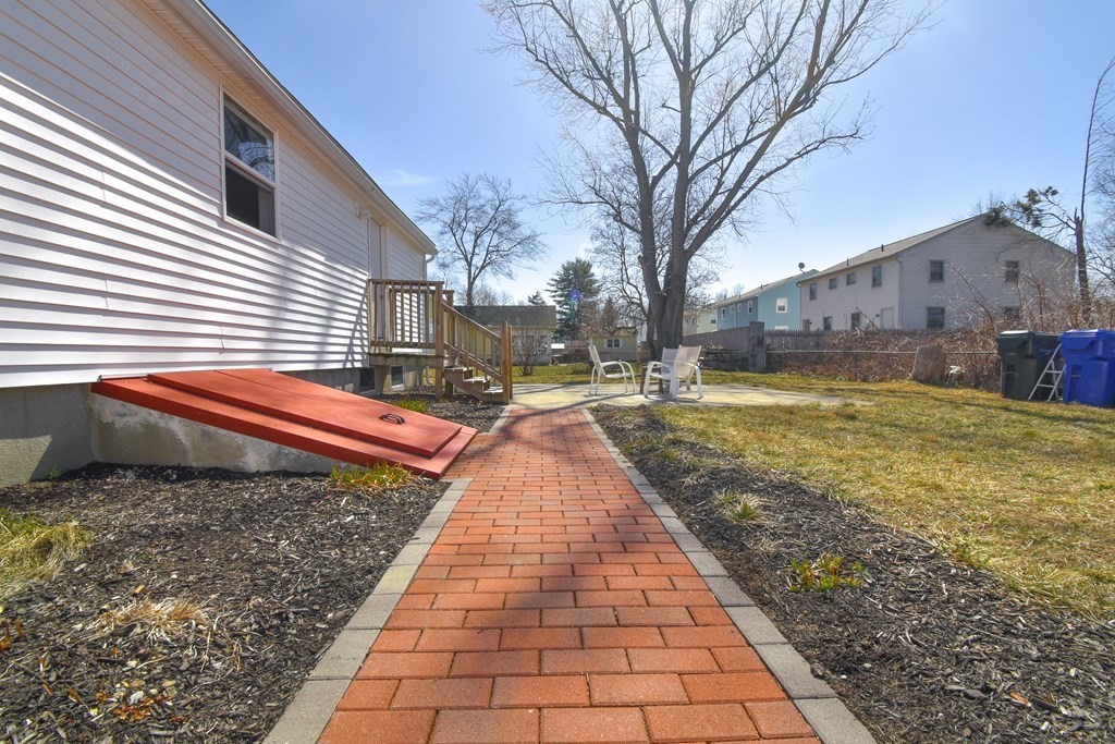 88 Dimmick Street Springfield, MA 01109 - Photo 32 of 36 a view of a yard with cars on road