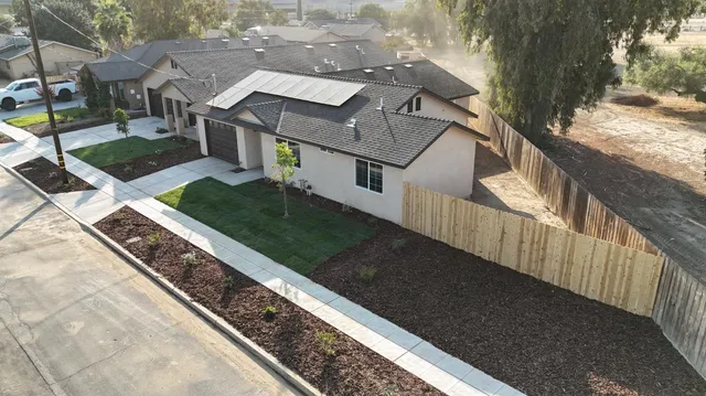 a view of a house with a small yard