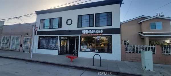 a front view of a house with barbeque grill