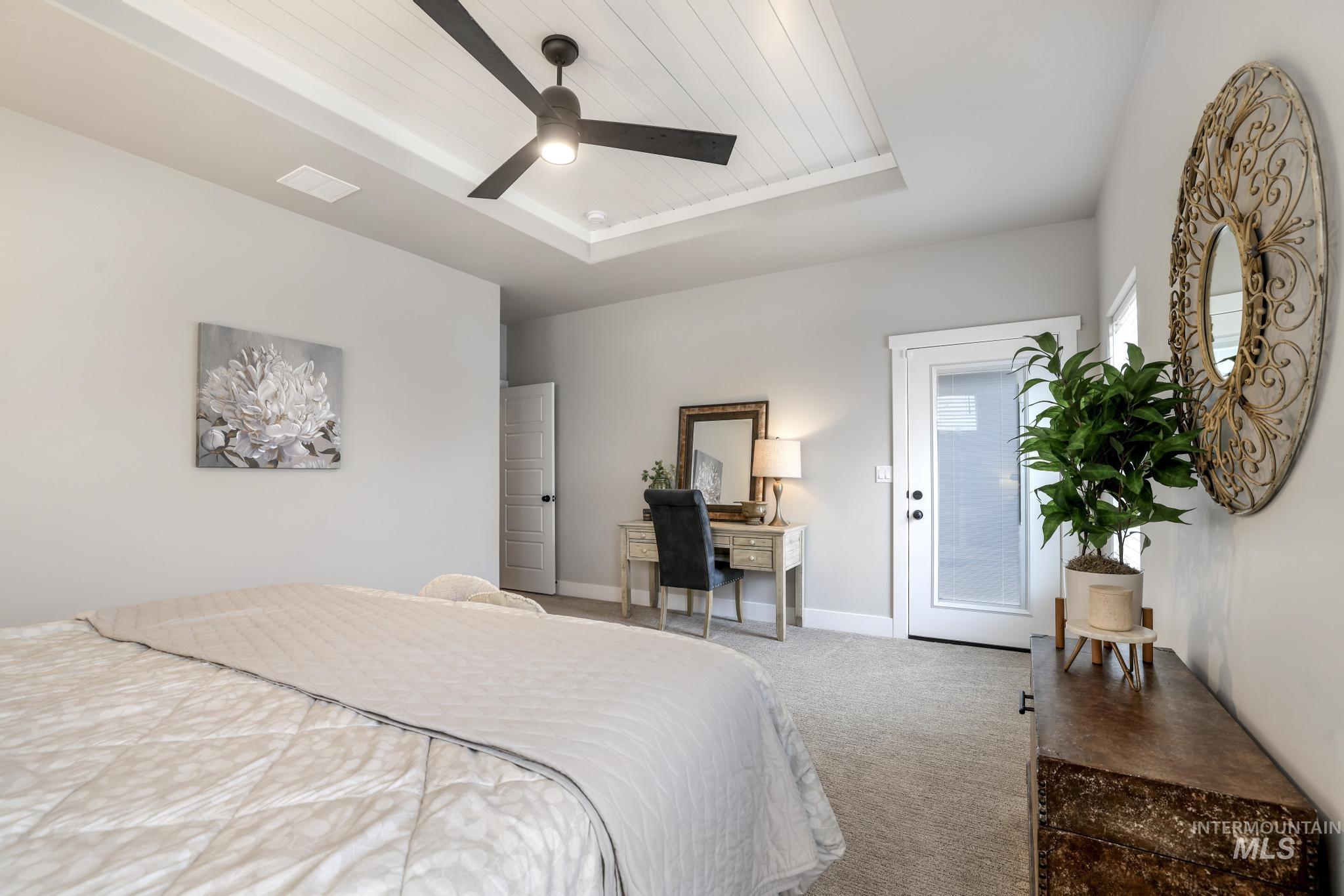 3103 Moonrise Road Twin Falls, ID 83301 - Photo 15 of 40 Carpeted bedroom with a wooden tray ceiling, access to outside, and a ceiling fan
