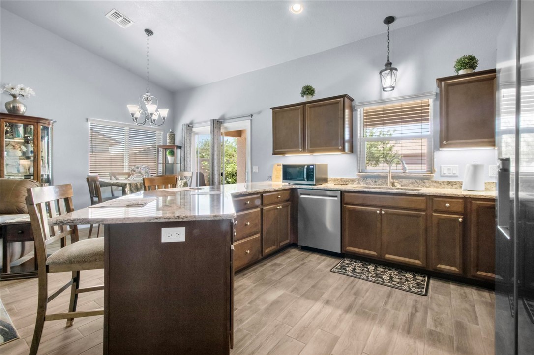 3897 Easy Street Kingman, AZ 86409 - Photo 11 of 53 a kitchen with a sink stove and cabinets