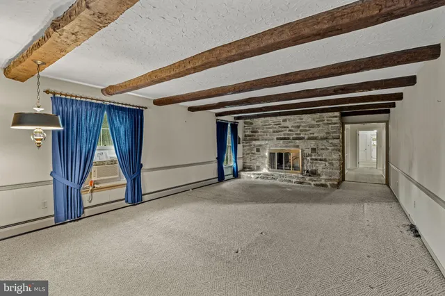 a living room with a fireplace