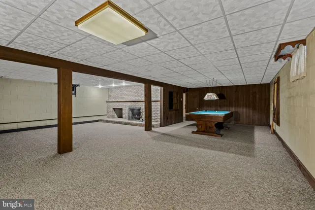 a view of an empty room with a fireplace