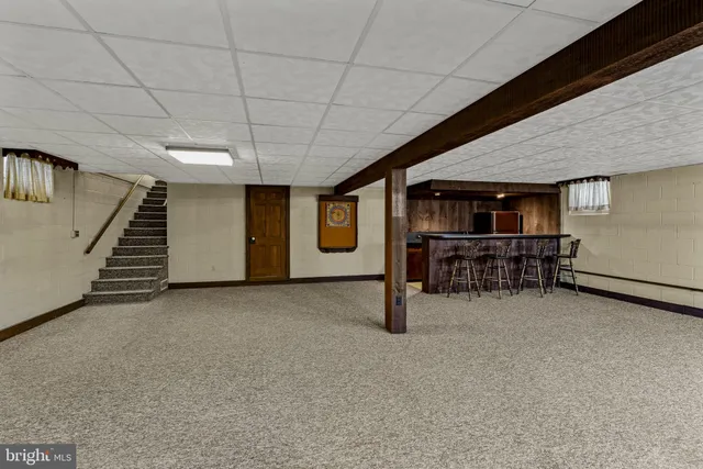 a view of an empty room with stairs