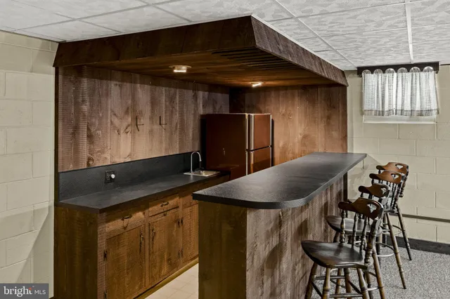 a kitchen with a table and chairs