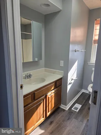 a view of a kitchen with a sink and a window