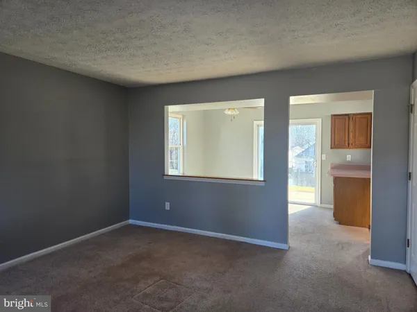 an empty room that has a window in it