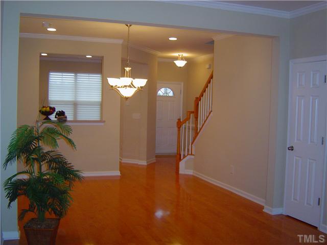 2714 Chilton Place Raleigh, NC 27616 - Photo 11 of 25 Upgraded light fixtures in hallway and dining room. Crown molding and hardwoods throughout 1st floor.