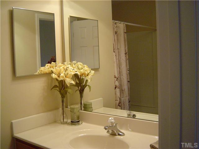 2714 Chilton Place Raleigh, NC 27616 - Photo 18 of 25 Master Bathroom has mirrored cabinet above vanity.