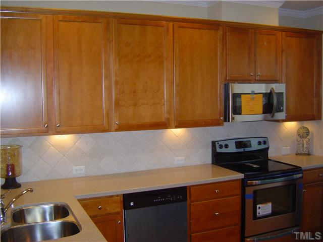 2714 Chilton Place Raleigh, NC 27616 - Photo 4 of 25 42" raised kitchen cabinets, double sinks and new stainless steel appliances.