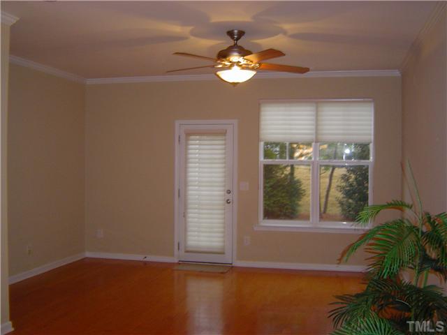2714 Chilton Place Raleigh, NC 27616 - Photo 9 of 25 Upgrades include, hardwood floor, fan, crown molding and Hunter Douglas Blindsblinds on back door and window.