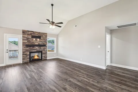 a view of a room with wooden floor