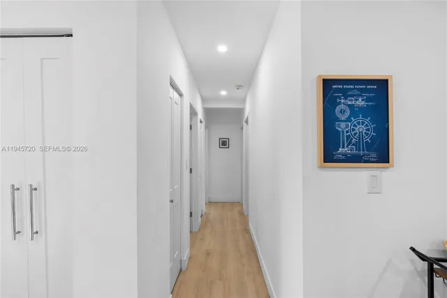 a kitchen with kitchen island a counter space a sink appliances and cabinets