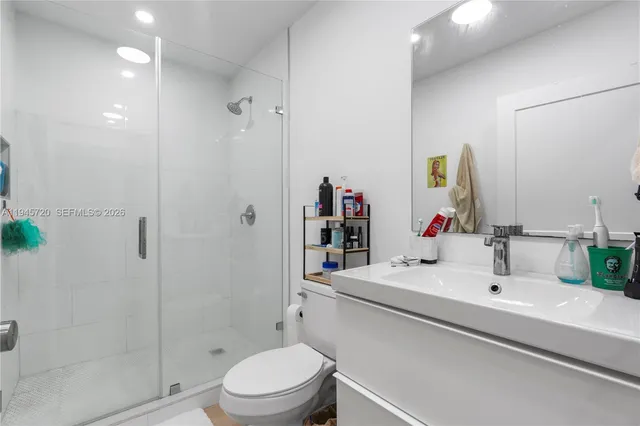 a bedroom with a bed and a chair