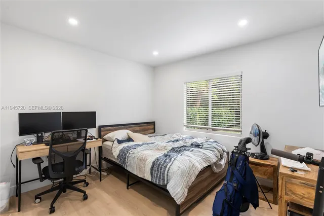 a bedroom with a bed and furniture