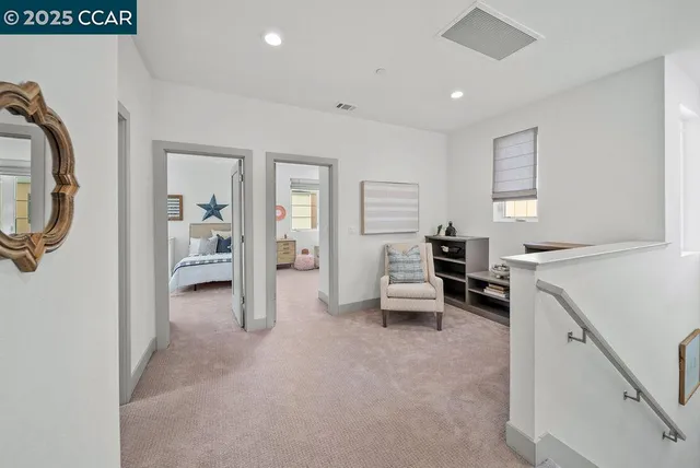 a view of a livingroom with entryway and furniture