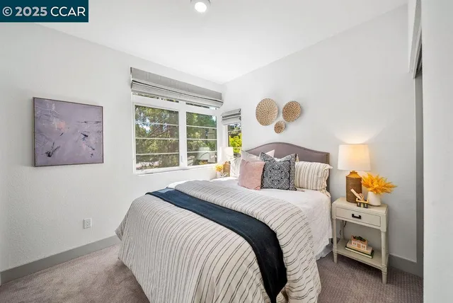 a bedroom with a bed and window