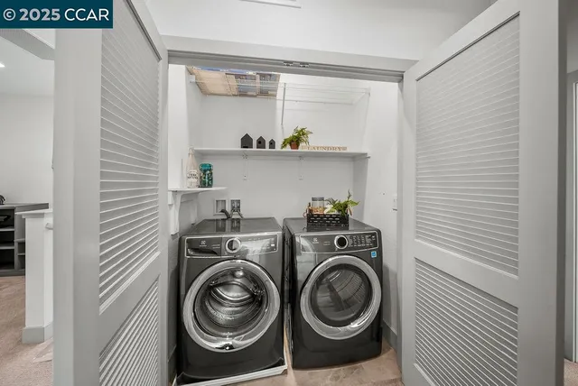 a utility room with sink dryer and washer