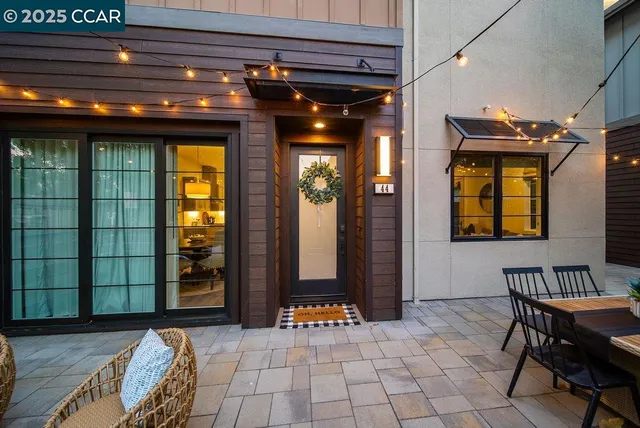 a view of a dinning table and chairs in the balcony