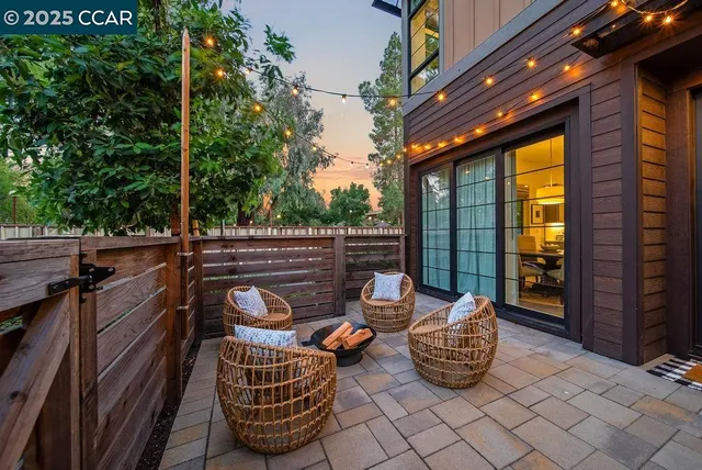 a view of a patio with a table and chairs