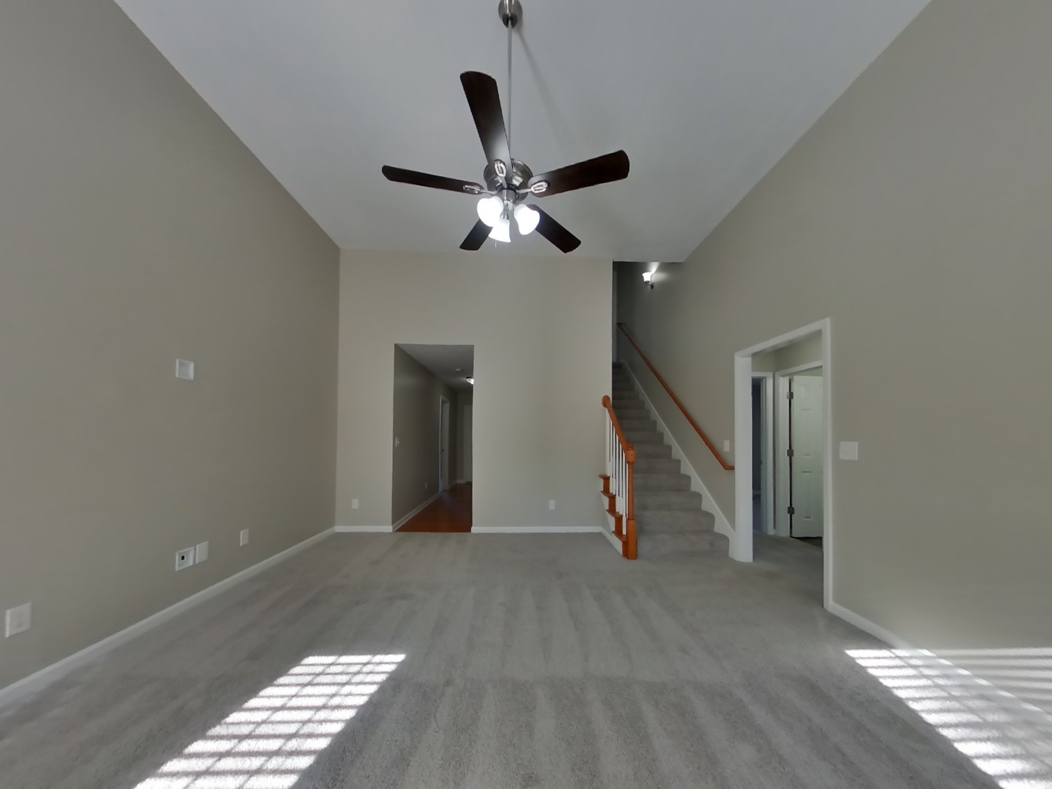 3505 Flora Drive Spring Hill, TN 37174 - Photo 3 of 18 a view of an empty room with wooden floor and a ceiling fan
