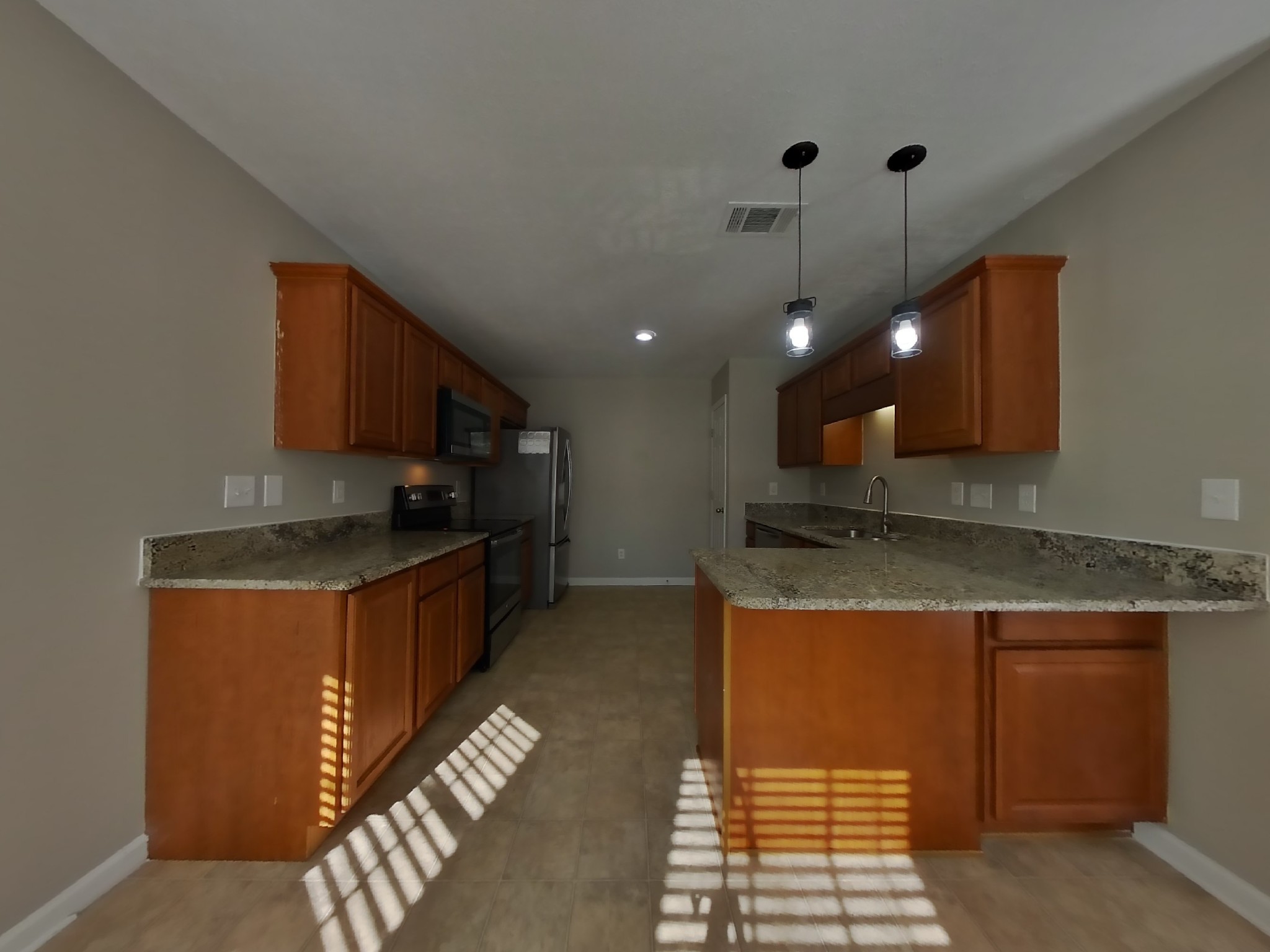 3505 Flora Drive Spring Hill, TN 37174 - Photo 4 of 18 a kitchen with stainless steel appliances granite countertop a sink a stove and a refrigerator
