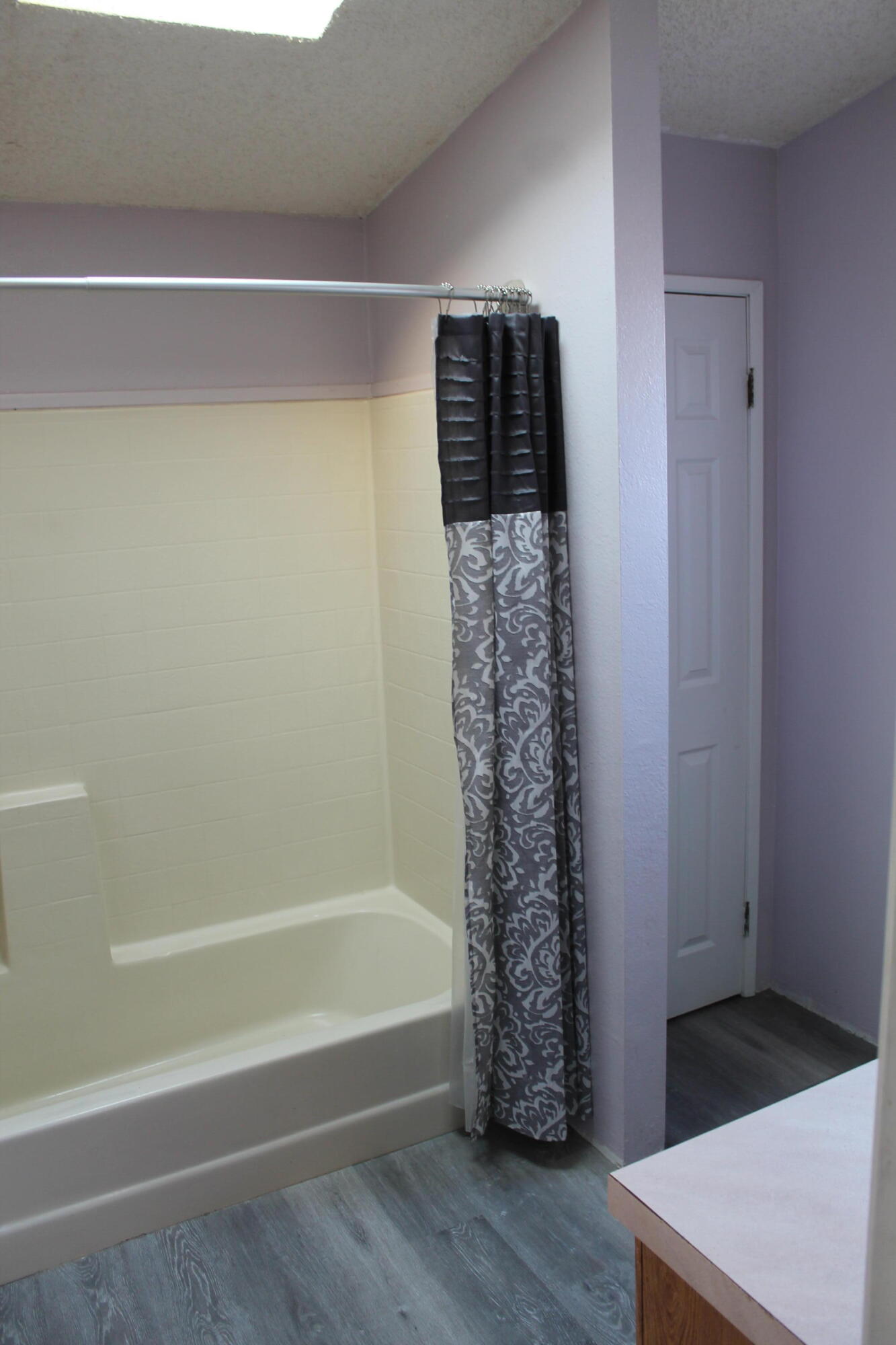 3589 West Wells Road, Unit 64 Blythe, CA 92225 - Photo 12 of 15 a bathroom with a bathtub and shower