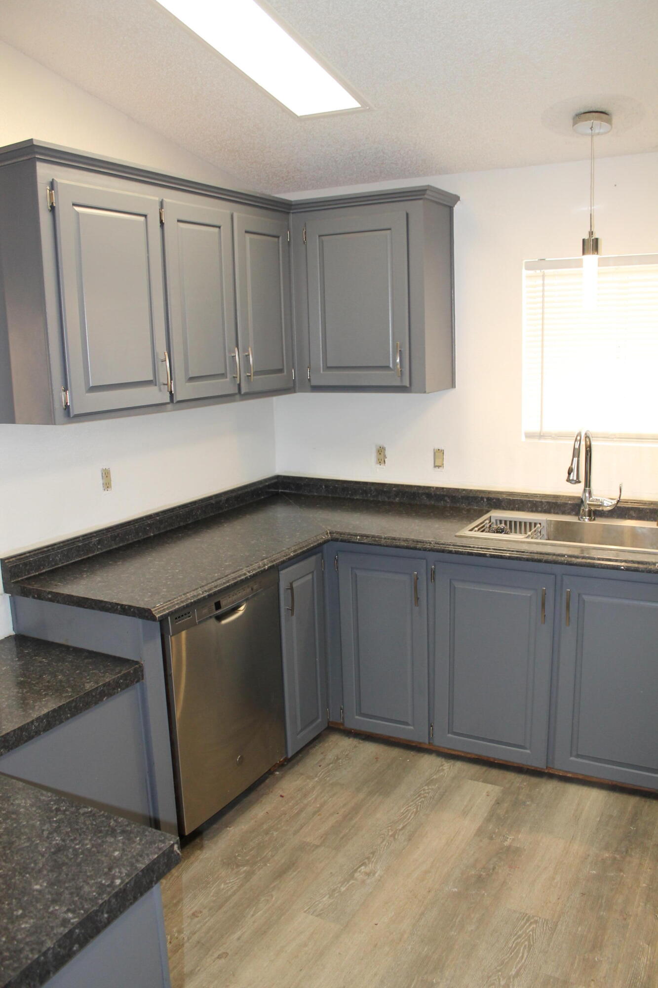 3589 West Wells Road, Unit 64 Blythe, CA 92225 - Photo 8 of 15 a kitchen with a sink and cabinets