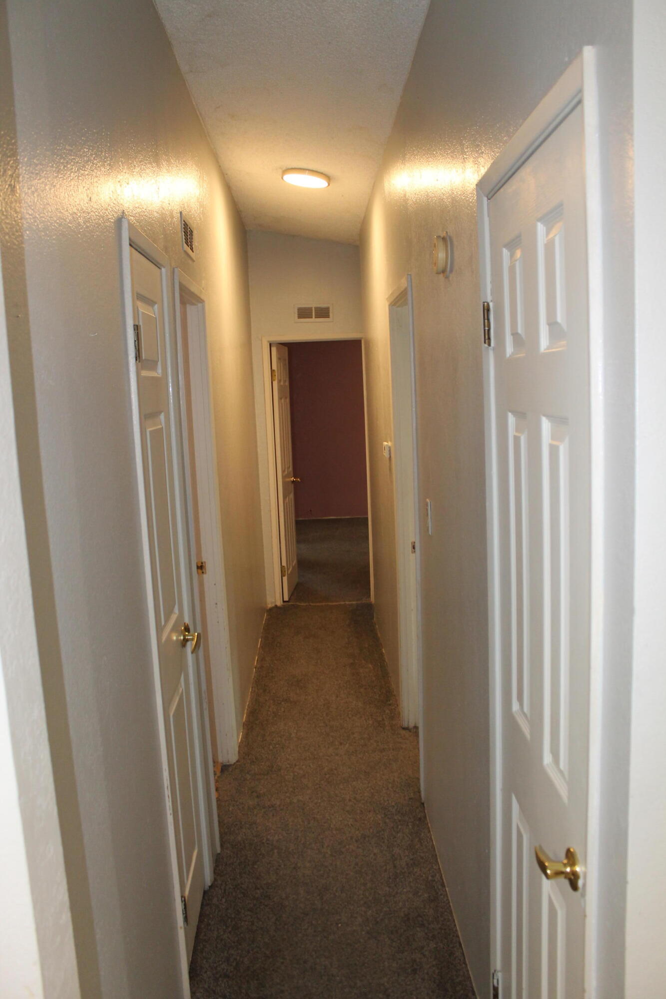 3589 West Wells Road, Unit 64 Blythe, CA 92225 - Photo 9 of 15 a view of a hallway with a room
