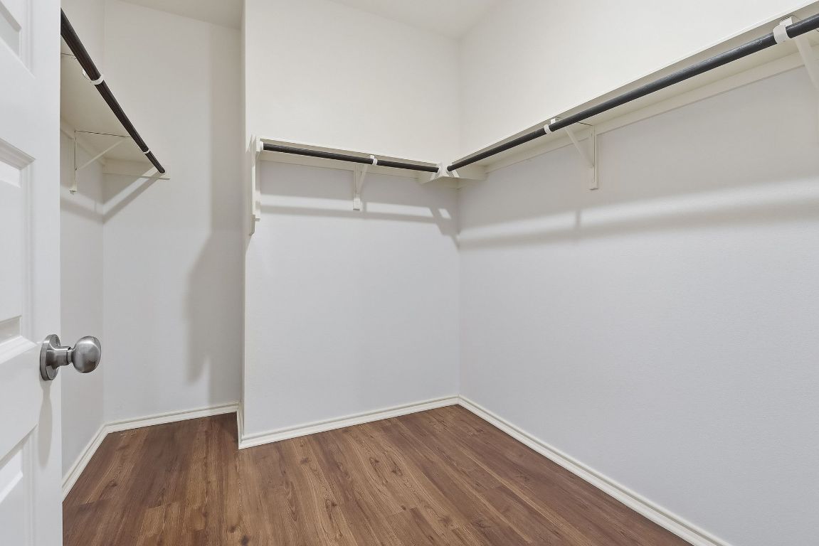 8001 Dampton Lane Austin, TX 78744 - Photo 17 of 38 a view of a room with wooden floor and staircase