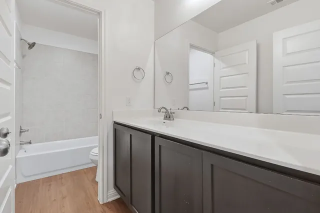 a bathroom with a sink and a bathtub