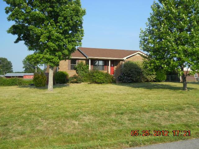 604 Jake Link Road Cottontown, TN 37048 - Photo 18 of 20 a front view of a house with a yard