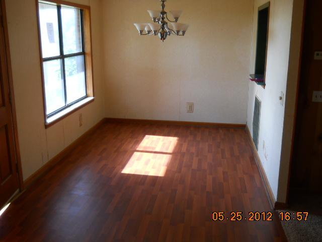 604 Jake Link Road Cottontown, TN 37048 - Photo 6 of 20 an empty room with wooden floor and windows