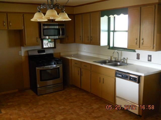 604 Jake Link Road Cottontown, TN 37048 - Photo 7 of 20 a kitchen with a stove sink and microwave